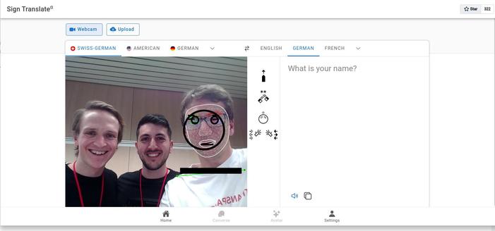 Screenshot of tool for sign language translation, on the side you see it's author and two enthusiastic testers at a hackathon