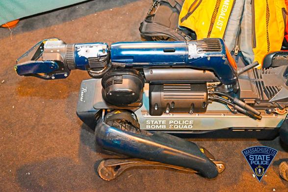 A Spot robot dog with bullet damage.