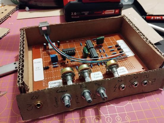 the cardboard prototype of the enclosure. the potentiometers and audio jacks are not spread out evenly due to the soft material.