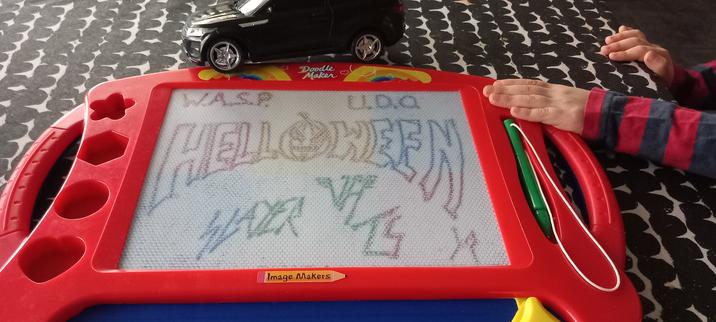 Etch-a-sketch with logos of 80s bands.