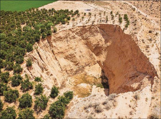drone photo, oblique - land subsidence in Iran due to groundwater pumping / extraction