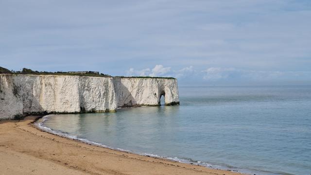 A beautiful white cliff with an arch on the English Channel, Kingsgate Bay, Kent.