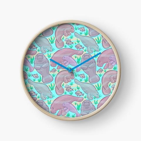 The manatees pattern from the first image applied to a clock with a wood frame and blue clock hands. It's a stock image from RedBubble
