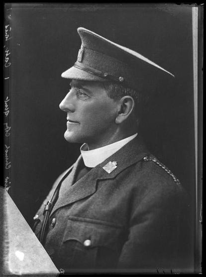 Black-and-white portrait photo: Reverend W. Grigg – Copy of photo of a gentleman. ca. 1920. Photographer, Henry Herbert Clifford. Description: From a glass-plate negative. One-quarter headshot showing the left-side view of a clean-shaven man in military uniform, wearing a military cap and a full clerical collar. Citation: Canterbury Museum, Clifford Collection, Accession No. 1980.175.26268. https://collection.canterburymuseum.com/objects/424567/glass-plate-negative-reverend-w-grigg-copy-of-photo-of-a-gentleman