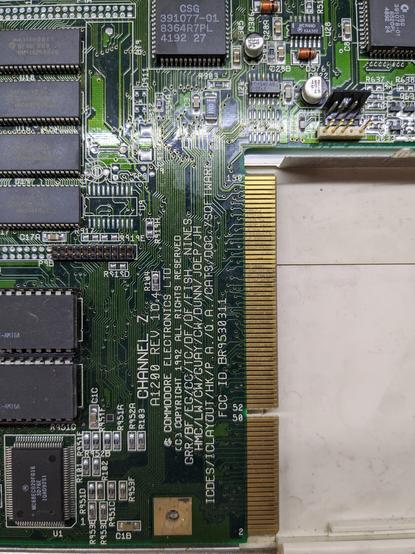 Closeup of the PCB of an Amiga 1200, near the trapdoor expansion edge connector, where revision and copyright are printed.
Revision is 1D4, copyright 1992