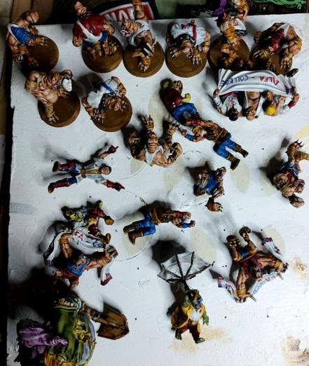 Bunch of mole rats and humans and a goblin all painted up and varnished