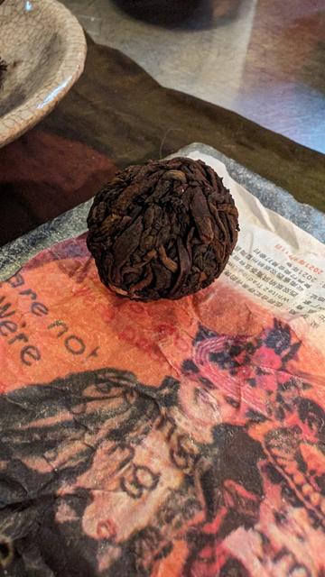 Shou Puerh mini on a colorful wrapper.