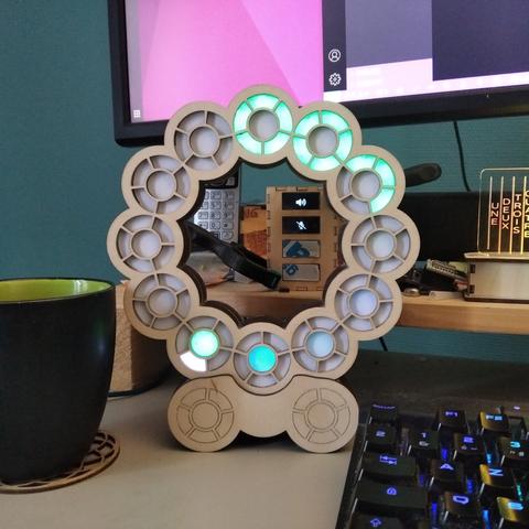 The clock stands on its own with no clamps.

It displays 7:13:37