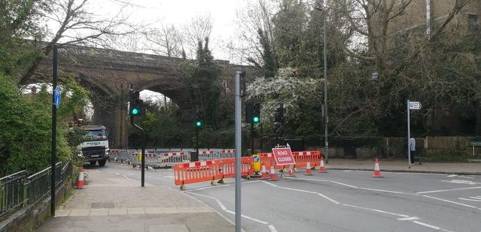 Photo looking down Crystal Palace Park Road towards the railway bridge showing road closure and diversion down Thicket Road