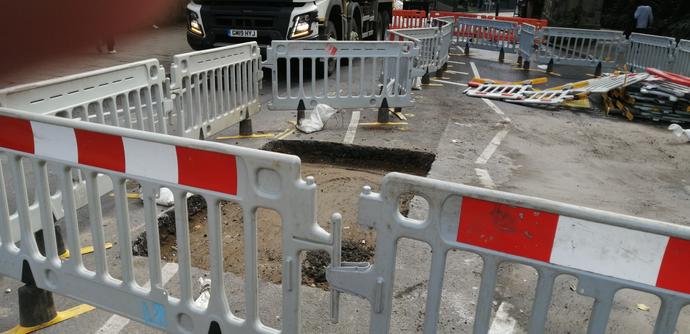 Photo showing actual hole. Rectangular in the middle of the road. Awaiting top dressing
