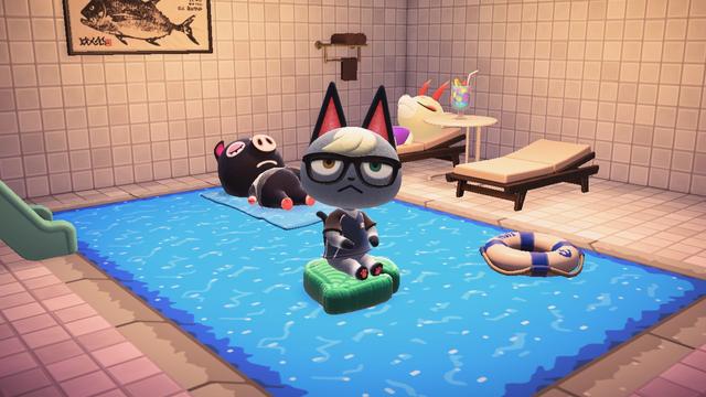Animal Crossing: New Horizons screenshot. Image is set to look like an indoor pool with a white tiled wall / flooring. Agnes (black pig) is floating in the pool on a custom designed towel, Shino (white deer with red horns) is laying on a pool seat with her eyes closed with a fruity looking drink next to her on a white table. Raymond is floating in the pool on a Nook Leaf shaped float. There is a small slide on the right-side of the pool partially off camera. A big Fish picture is also on the wall.