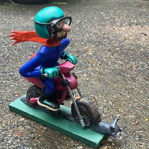 The same figurine from a different angle, you can see the scarf billowing behind him.