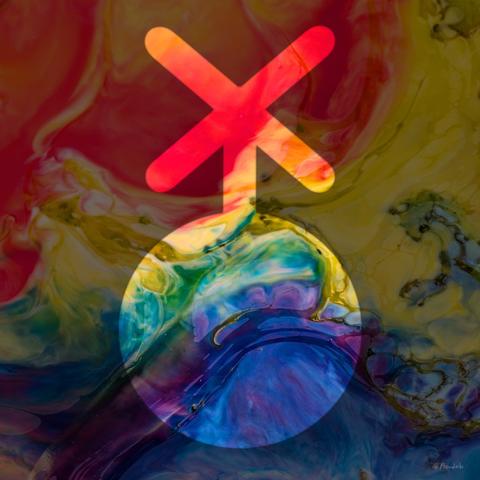 A photo of rainbow poured wax with a nonbinary symbol superimposed on it