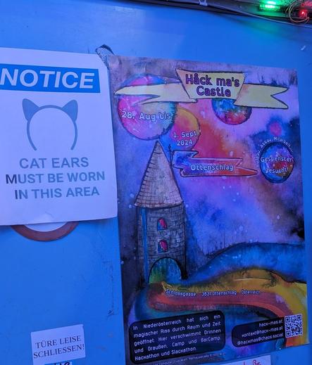 Realraum's door between space1 and space2, proudly featuring a poster advertising the Håck-mas-Castle Hacker Event