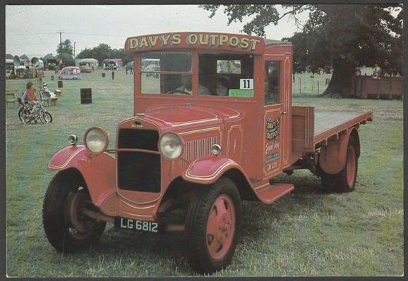Printed colour postcard showing a 1931 Model A Ford flat platform truck, Davy's Outpost, LG 6812.
Printed by The Commercial Centre Limited, No CV5.
Postally unused.
Very good condition.