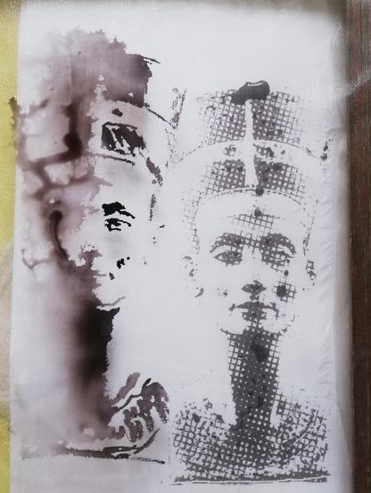The model, and a painting on gauze, showing the famous head of Nefertiti. Some of the painted image is crisp, but the part painted on damp gauze has run far and fast.