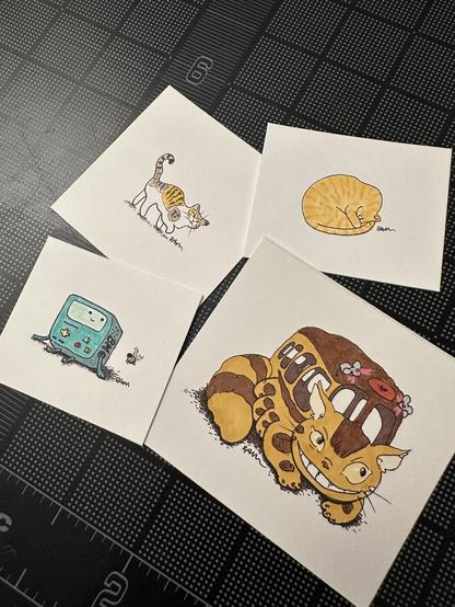 Four small drawings, including two kitties, BMO from Adventure Time, and Catbus from “My Neighbor Totoro”