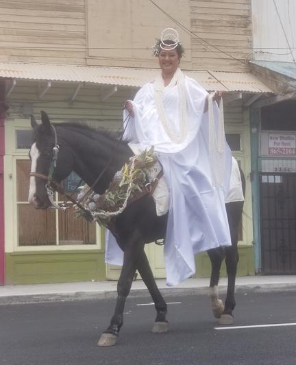 Fancy dressed woman on a fancy dressed horse.