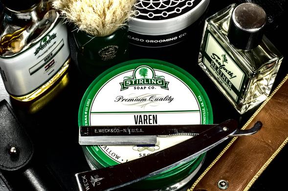 A Weck Sextroblade med prep on a tub of Stirling Varen soap amongst bottles of Varen Splash and Seaforth! Heather frag, straight razor pouches, a Zenith MOAR BOAR brush and CGC AG 1889 soap