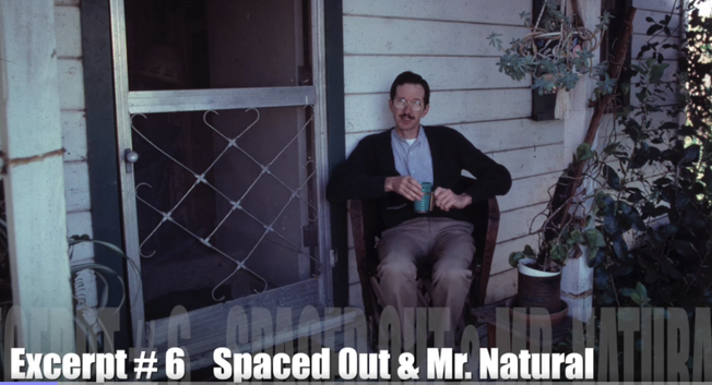 Screenshot of #6 in the video series from a conversation with Robert Crumb 1980. Crumb sits in his wicker chair at the front door of the house in Winters, California with a coffee mug in hand.