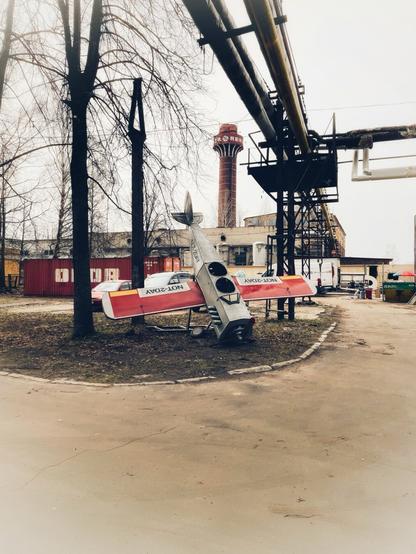 A model plane in an industrial district.