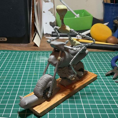 Now has added snails on both wheels. And is joined by a wire and milliput skeleton sitting on the motorbike.