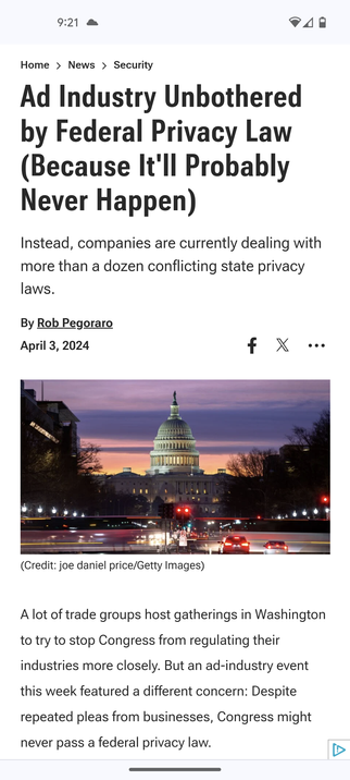 Screenshot of the story as seen in Chrome for Android. The art accompanying it is a photo of the Capitol before sunrise, with a red traffic light in the foreground.