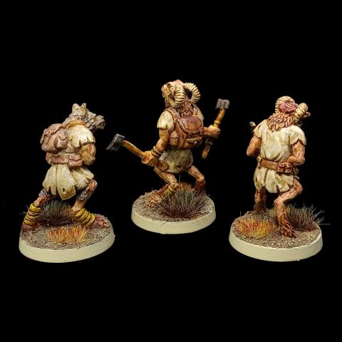 The backs of the figures, two of them have backpacks.
