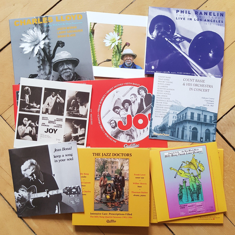 assembly of CD artwork on wooden floor, albums by Charles Lloyd, Phil Ranelin, Joy, Count Basie & His Orchestra, Jean Bonal and The Jazz Doctors