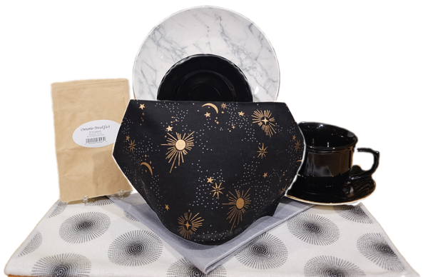 A tea tableau representing the Solar Eclipse. The tea is Ontario Breakfast black tea from English Tea Store.