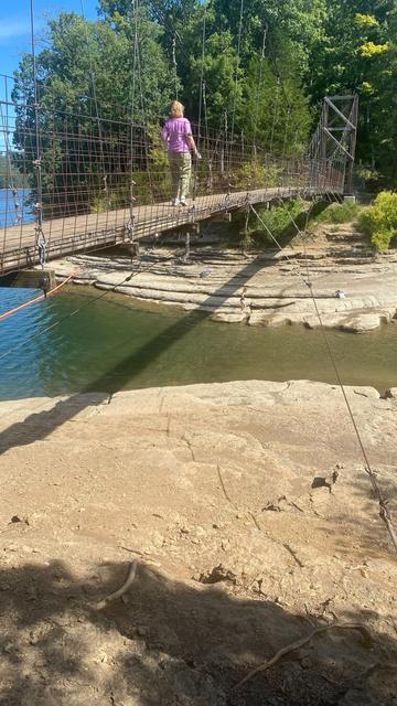 Suspension bridge over lake at Pickett CCC Memorial State Park in Pickett County Tennessee