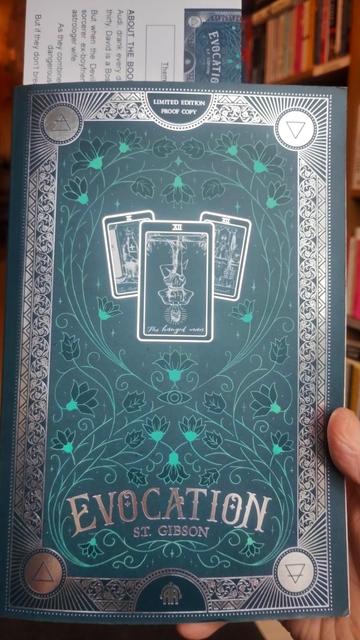 Beautifully decorated green and silver cover, with patterns and Tarot cards