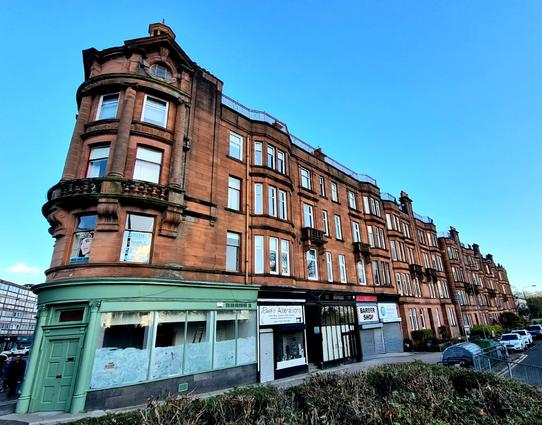 A grand red sandstone Edwardian Glasgow tenement.