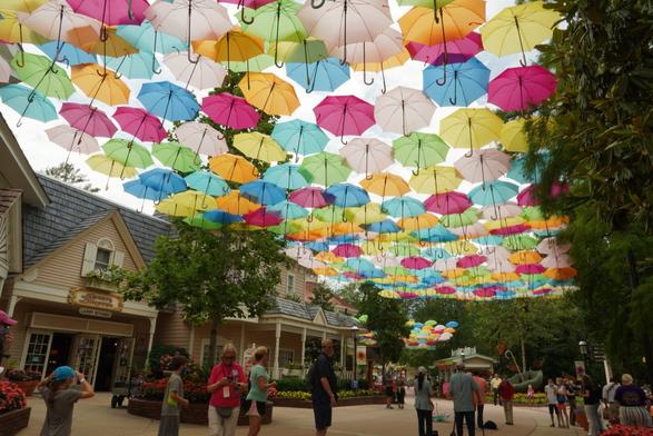 Colorful umbrellas handing over the walking path into the Dollywood resort in Pigeon Forge. Tennessee