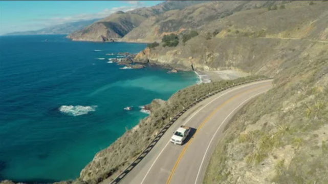 Third person bird's eye view of car driving down PCH