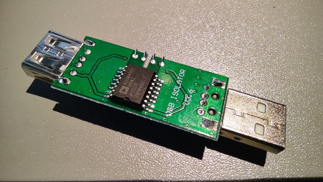 The same PCB, but positioned 'face down' - visible traces on the PCB and a circuit with the label 'adum4160'.