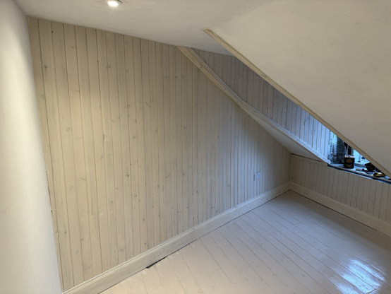 Wood washed timber panelled wall