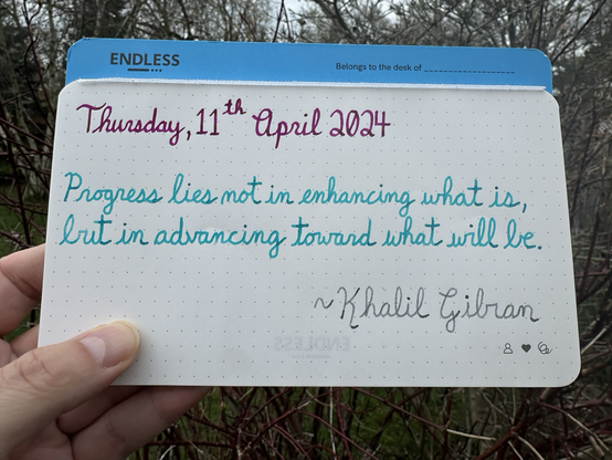 A one quote of Khalil Gibran that reads, “Progress lies not in enhancing what is, but in advancing toward what will be.”  Written in Pilot Iroshizuku Yama-Budo, Pelikan Edelstein Apatite & Wearingeul I am a Cat. 🐈‍⬛