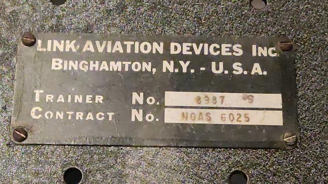 The manufacturer's badge: "Link Aviation Devices Inc. Binghamton, N.Y. - U.S.A."

Below that: "Trainer number" and "Contract number"