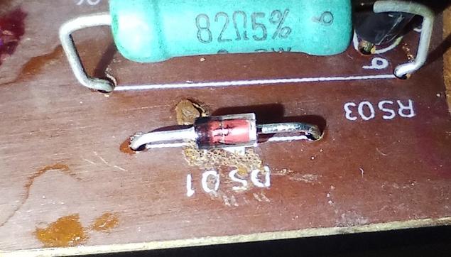 the new zener diode. there still is some gunk from before, but that is just very hard glue residue. it won't harm.
