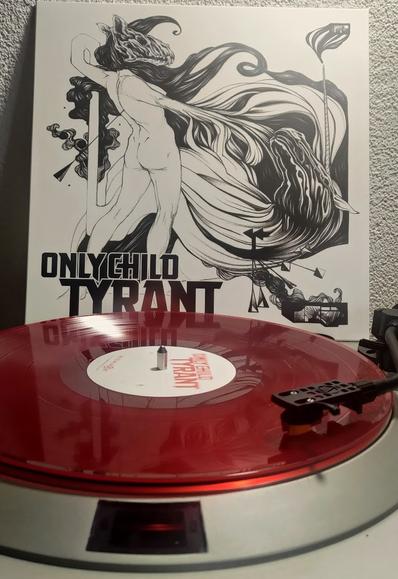 The album "Time To Run" by Only Child Tyrant playing on a Denon DP-30L turntable.

The vinyl is transparent red. In the background, the cover is shown. It displays a lb/w line drawing of naked human figure with a  canine's skull for a head. Its arm sprouts into vaguely hair- or fabric-like lines. The figure seems to have an arrow lodged between the shoulder blades.