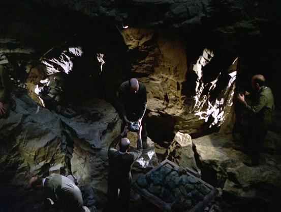 A scene from Author, Author, where four EMH holograms similar to the Doctor are repurposed for manual labor in a mine.