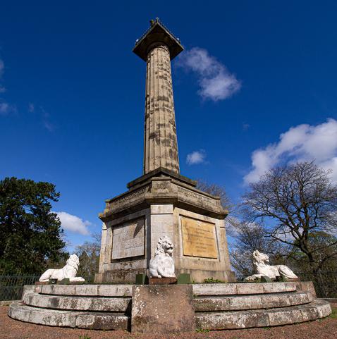 Foreshortened shot of a stone column to the Duke Of Northumberland with inscribed plaque at the bottom