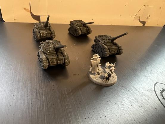Warhammer 40K Epic Miniatures

Four Basilisk Artillery tanks, unpainted. One Solar Auxiliary Command Squad.