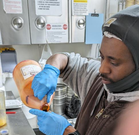 A Mitchell's employee making ice cream