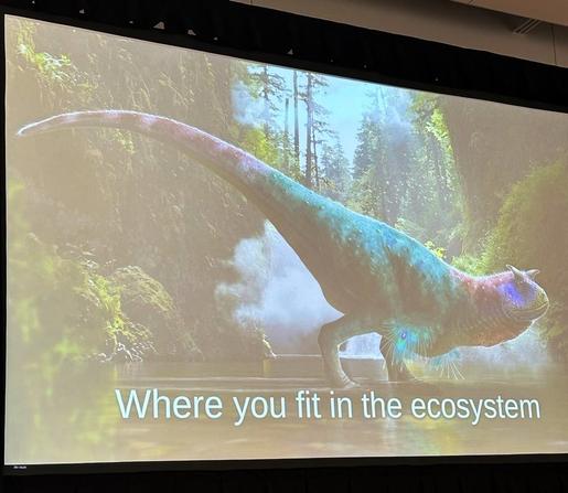 A picture of a feathered dinosaur and the words “where you fit in the ecosystem”