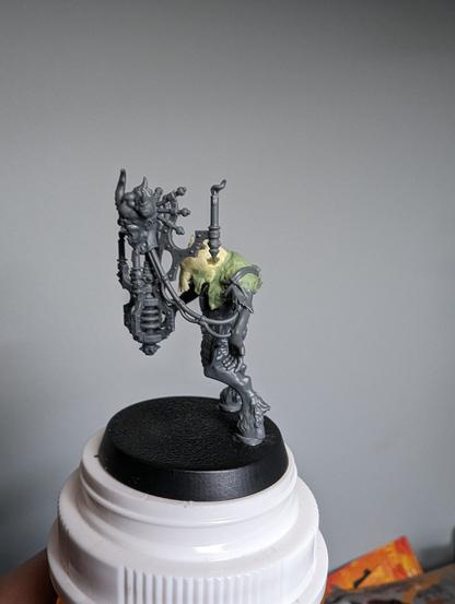 Converted beastman miniature with sculpted detail, left side view