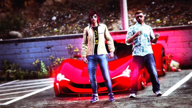 A screenshot I took in the video game GTA Online using the Rockstar Editor. It was taken during a Grotti (Ferrari) themed crew meet and shows my male character doing a steering gesture next to a fellow crew members female character. Both are standing in front of a red Grotti super car.