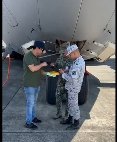 Indian officials offering sweets to the Philippines Marine Corps officers
