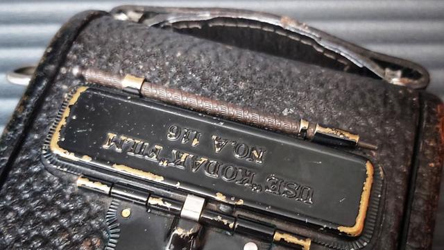 The rear of a Kodak 1A Autographic Jr folding camera with the Autographic stylus in place.